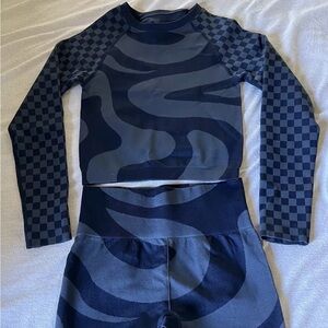 Fabletics two-piece cropped long sleeve top and full length leggings.